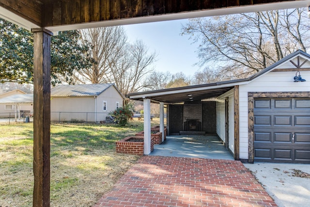 exterior space with a carport and a garage