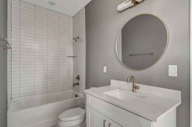 full bathroom featuring vanity, tiled shower / bath combo, and toilet