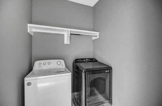 laundry area with washing machine and dryer