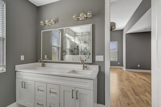 bathroom featuring vanity, hardwood / wood-style flooring, and walk in shower