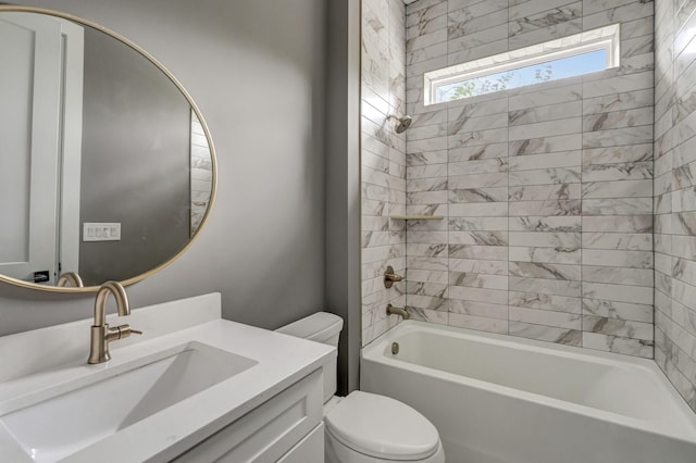 full bathroom with vanity, toilet, and tiled shower / bath