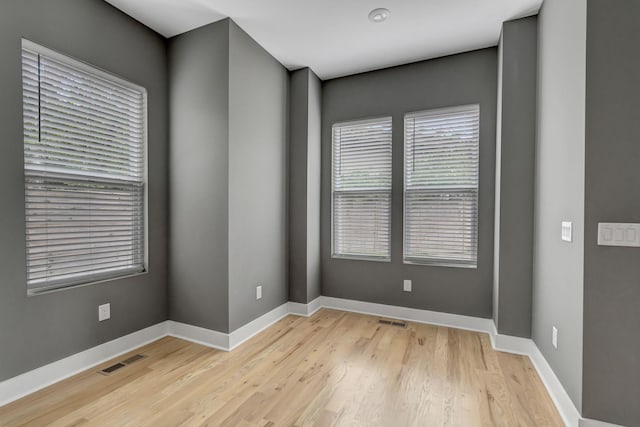 unfurnished room featuring light hardwood / wood-style floors