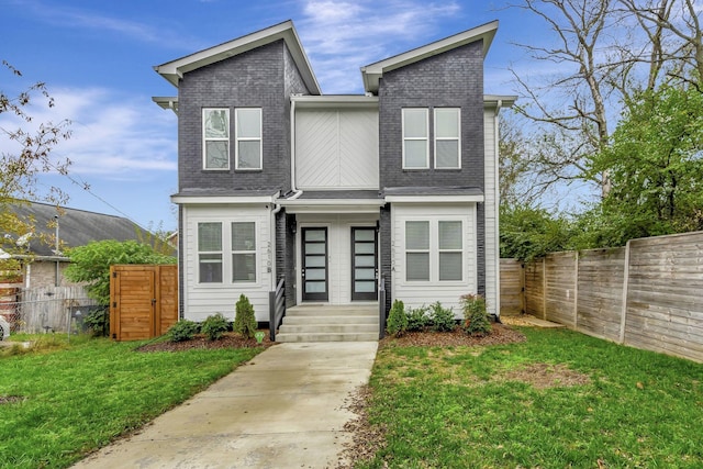 view of front of property with a front lawn