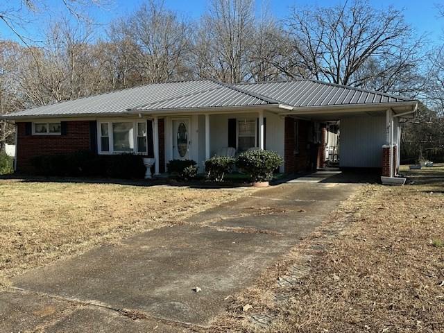 ranch-style house with a carport