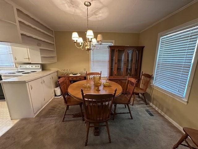 1487 Natchez Trace Rd, Camden, TN 38320 - carpeted dining room featuring a chandelier and ornamental molding