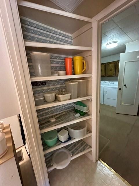 pantry with washing machine and clothes dryer