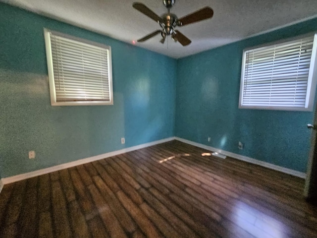 spare room featuring hardwood / wood-style floors and ceiling fan