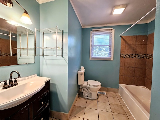 full bathroom featuring vanity, tile patterned floors, crown molding, tiled shower / bath combo, and toilet