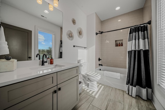 bathroom with shower / bath combination with curtain and vanity