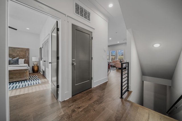 corridor featuring wood-type flooring