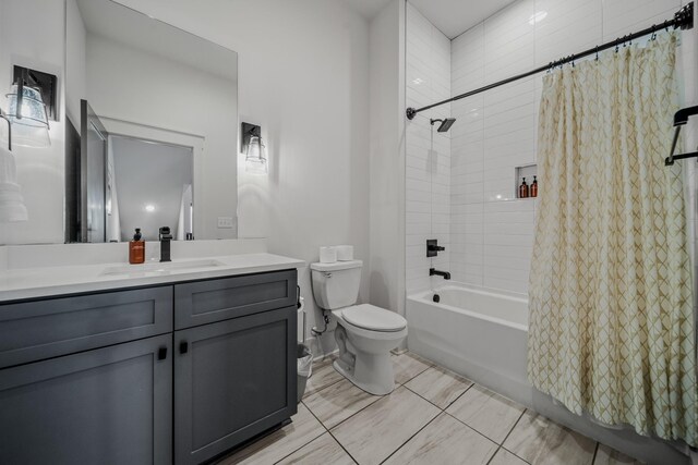 full bathroom with toilet, vanity, tile patterned floors, and shower / bath combo with shower curtain