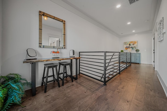 hall with crown molding and dark hardwood / wood-style flooring