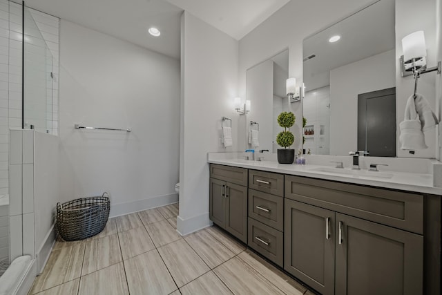 bathroom with vanity, toilet, and an enclosed shower