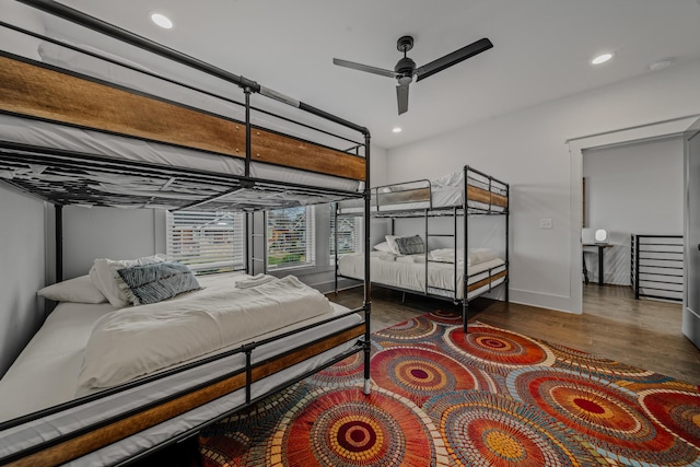 bedroom featuring ceiling fan and dark hardwood / wood-style floors