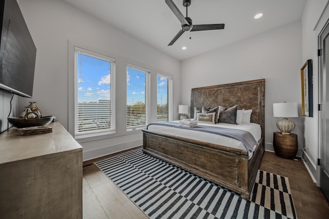 bedroom with ceiling fan and dark hardwood / wood-style floors