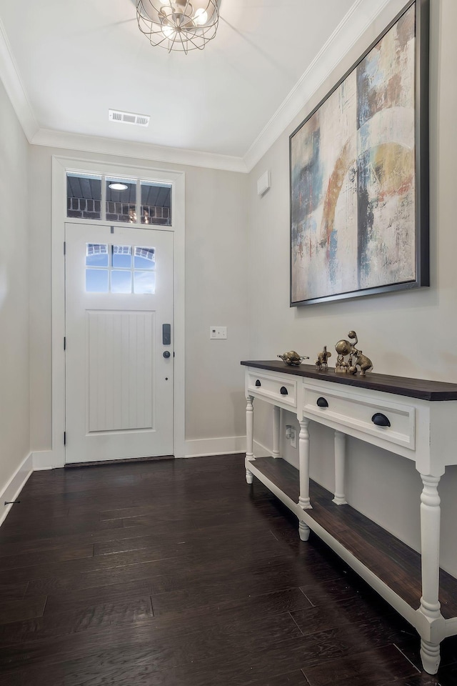 foyer with hardwood / wood-style floors and crown molding