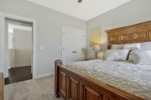 carpeted bedroom featuring ceiling fan and a closet