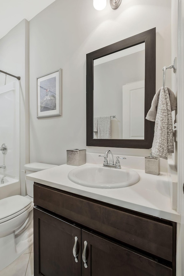 full bathroom with tile patterned flooring, vanity, toilet, and washtub / shower combination