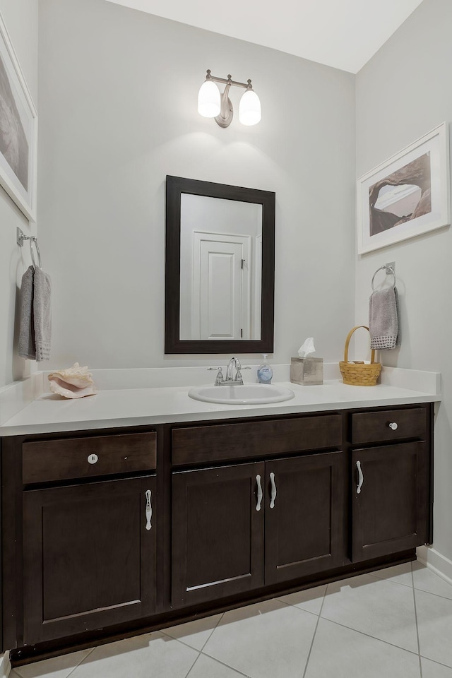 bathroom featuring tile patterned flooring and vanity