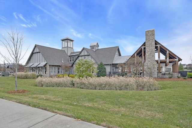 view of property's community with a yard