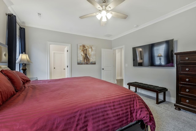 bedroom featuring light colored carpet, ceiling fan, and crown molding