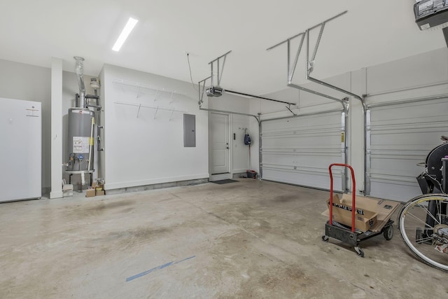 garage featuring electric panel, white fridge, a garage door opener, and water heater