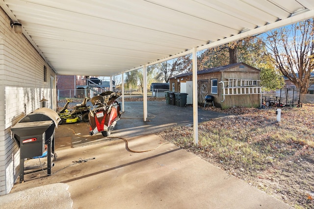 view of patio / terrace featuring grilling area and an outdoor structure