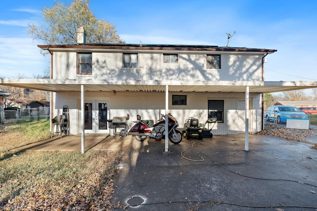 back of property featuring french doors