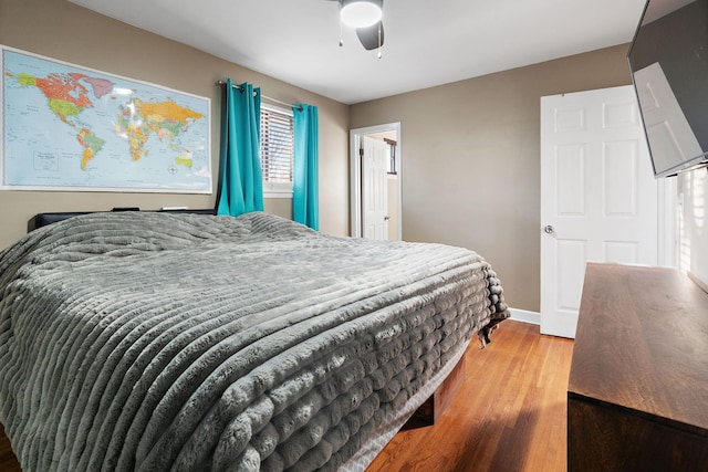 bedroom featuring hardwood / wood-style flooring and ceiling fan