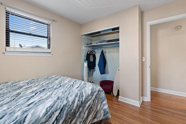 bedroom featuring a closet and hardwood / wood-style flooring