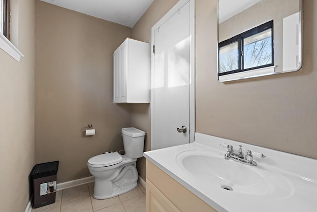 bathroom featuring tile patterned floors, vanity, and toilet