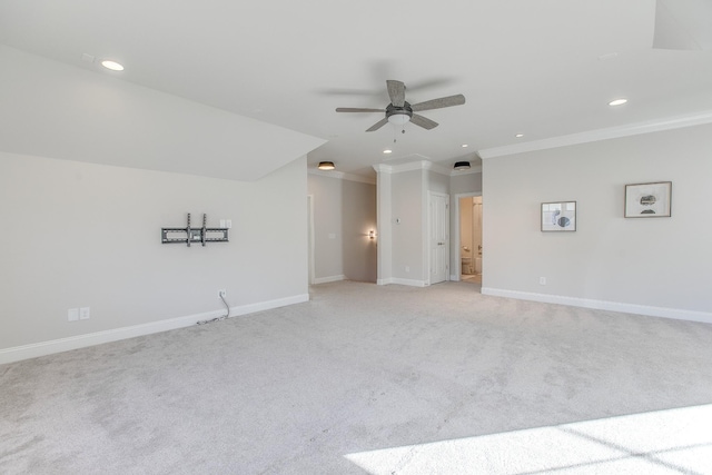 carpeted spare room with ornamental molding and ceiling fan