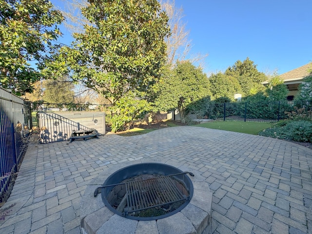 view of patio featuring a fire pit