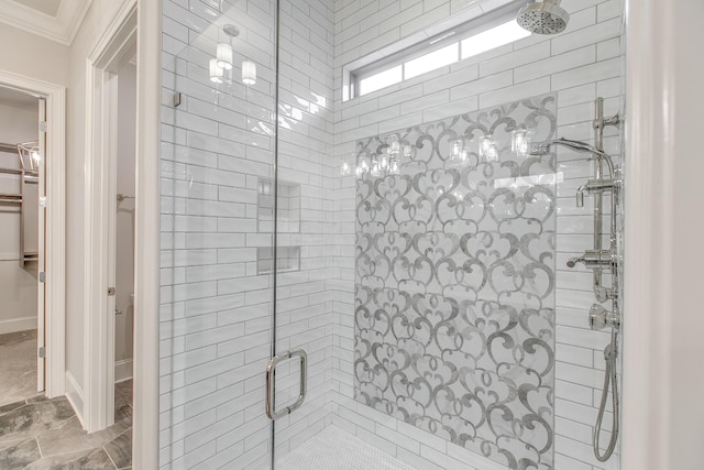 bathroom with crown molding and walk in shower