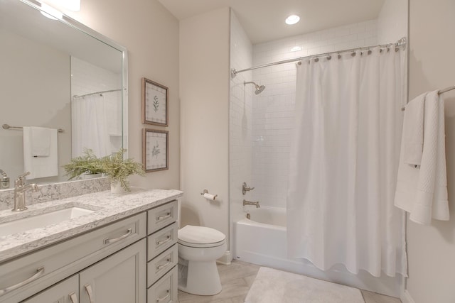 full bathroom featuring vanity, shower / bath combination with curtain, and toilet