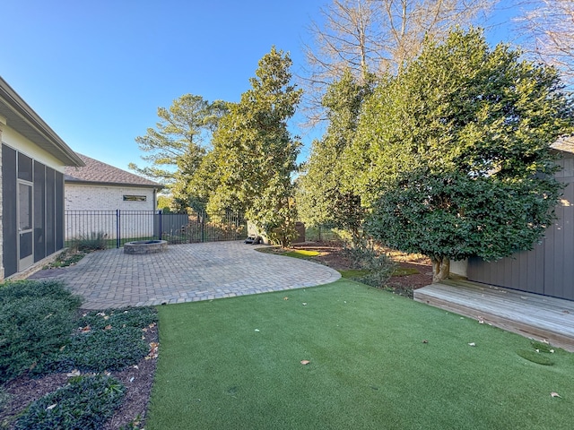 view of yard featuring a patio and a fire pit