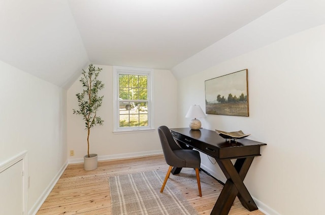 office area featuring light wood-type flooring and lofted ceiling