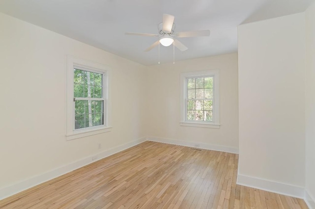 spare room featuring ceiling fan and light hardwood / wood-style floors