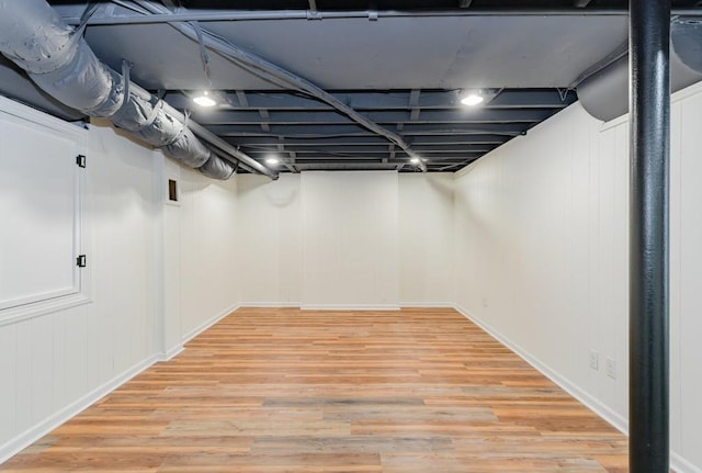 basement featuring hardwood / wood-style flooring