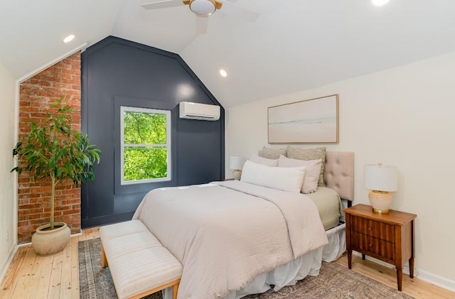 bedroom featuring a wall mounted air conditioner, ceiling fan, wood-type flooring, and lofted ceiling