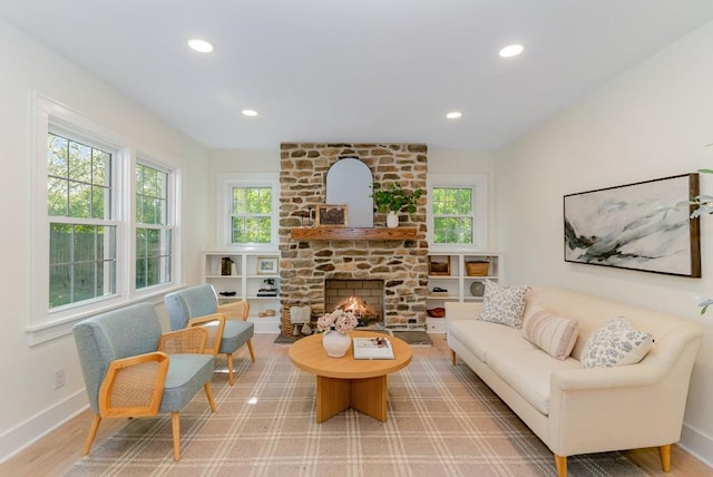 living room featuring a fireplace and hardwood / wood-style floors