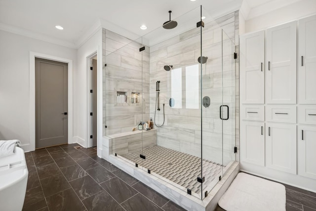 bathroom featuring a shower with door and ornamental molding