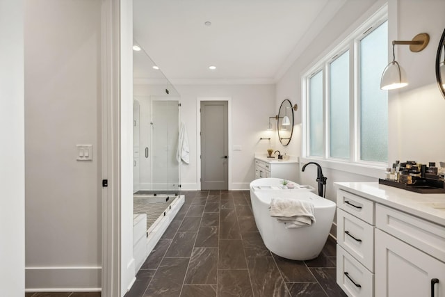 bathroom featuring plus walk in shower, vanity, and ornamental molding