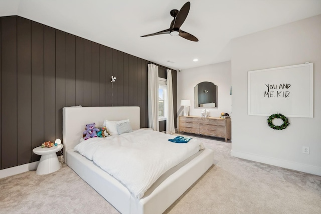 carpeted bedroom featuring ceiling fan, lofted ceiling, and wooden walls