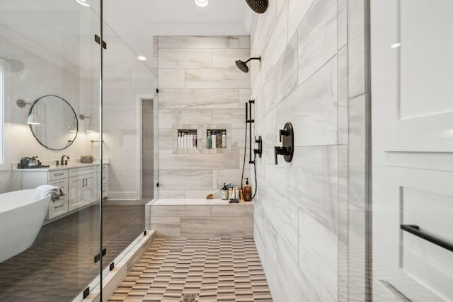 bathroom featuring tile patterned floors, vanity, and shower with separate bathtub