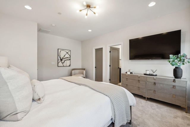 bedroom featuring light carpet and a chandelier