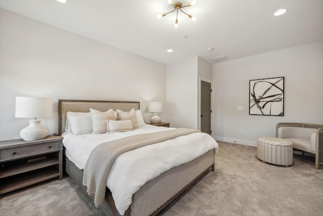 carpeted bedroom featuring a chandelier