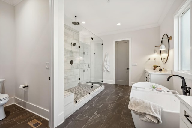 bathroom featuring vanity, toilet, a shower with door, and crown molding