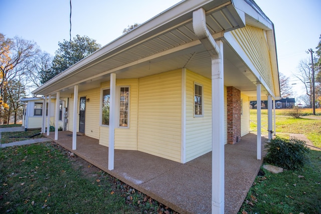 view of property exterior with covered porch