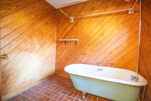 432 Menees Ln, Madison, TN 37115 - bathroom featuring a freestanding tub, brick patterned flooring, and wood walls